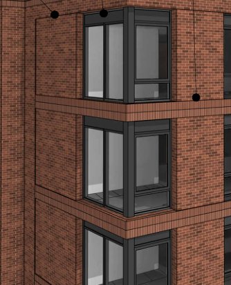 Detail of the red brick section with corner windows.